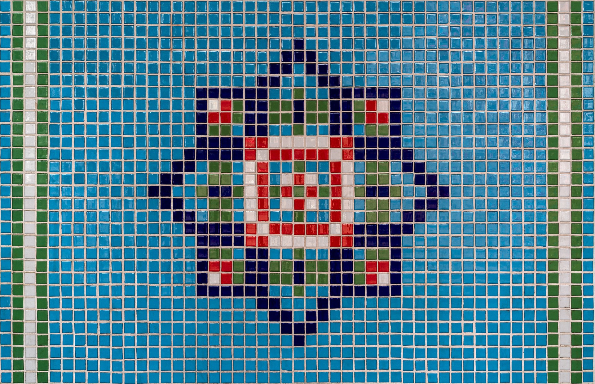 Seamless colorful white, green, blue and red mosaic marble wall tile texture in geometric small square shape pattern for background and wallpaper