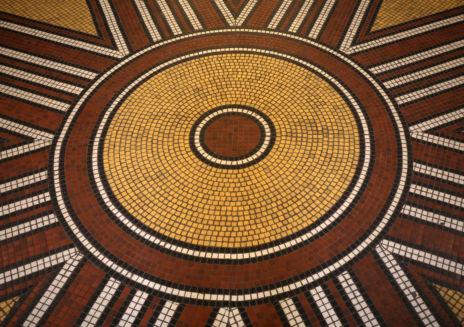 Mosaic floor with multicolored small square tiles with an abstract pattern
